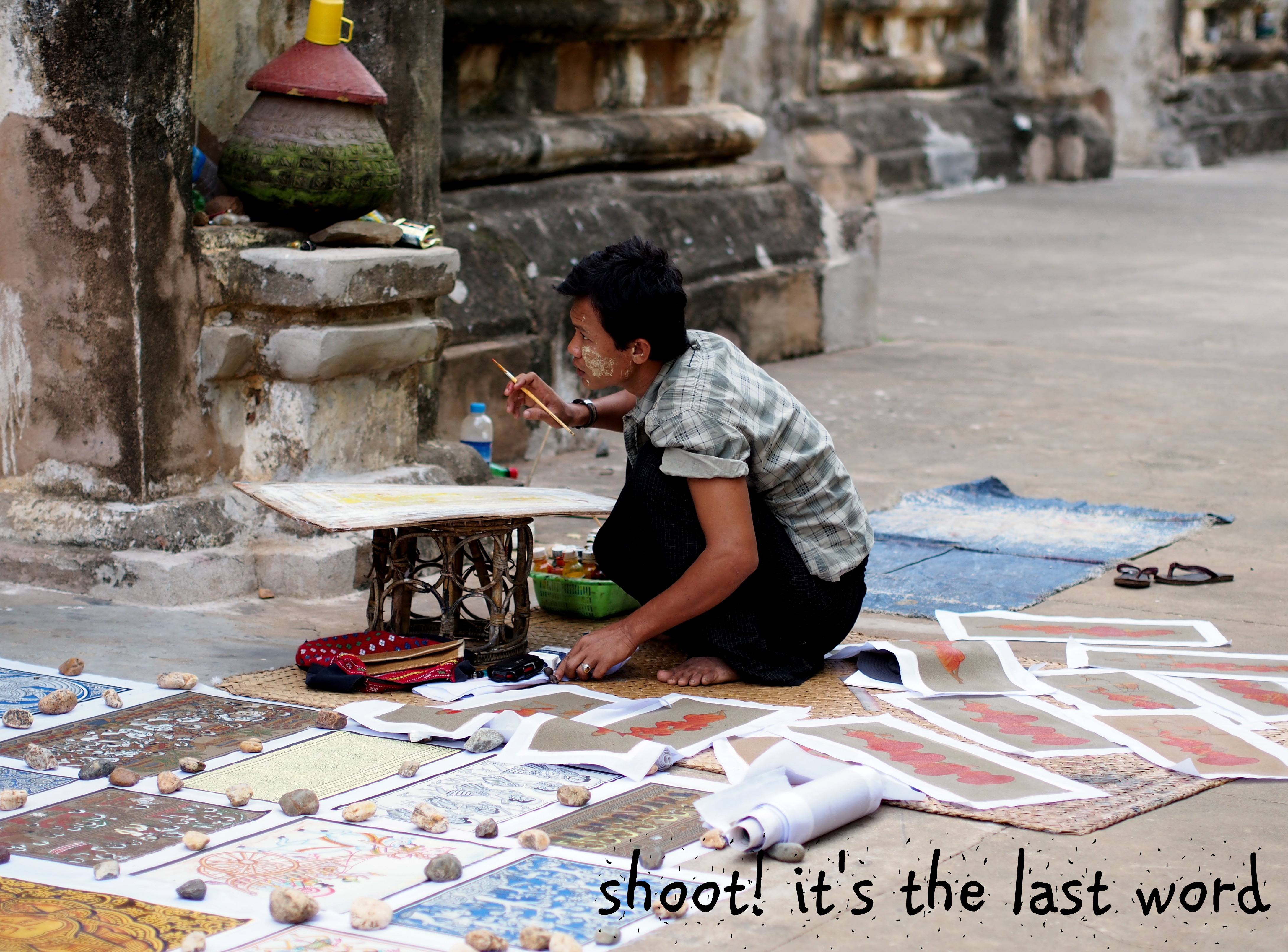 artist selling his wares outside temple