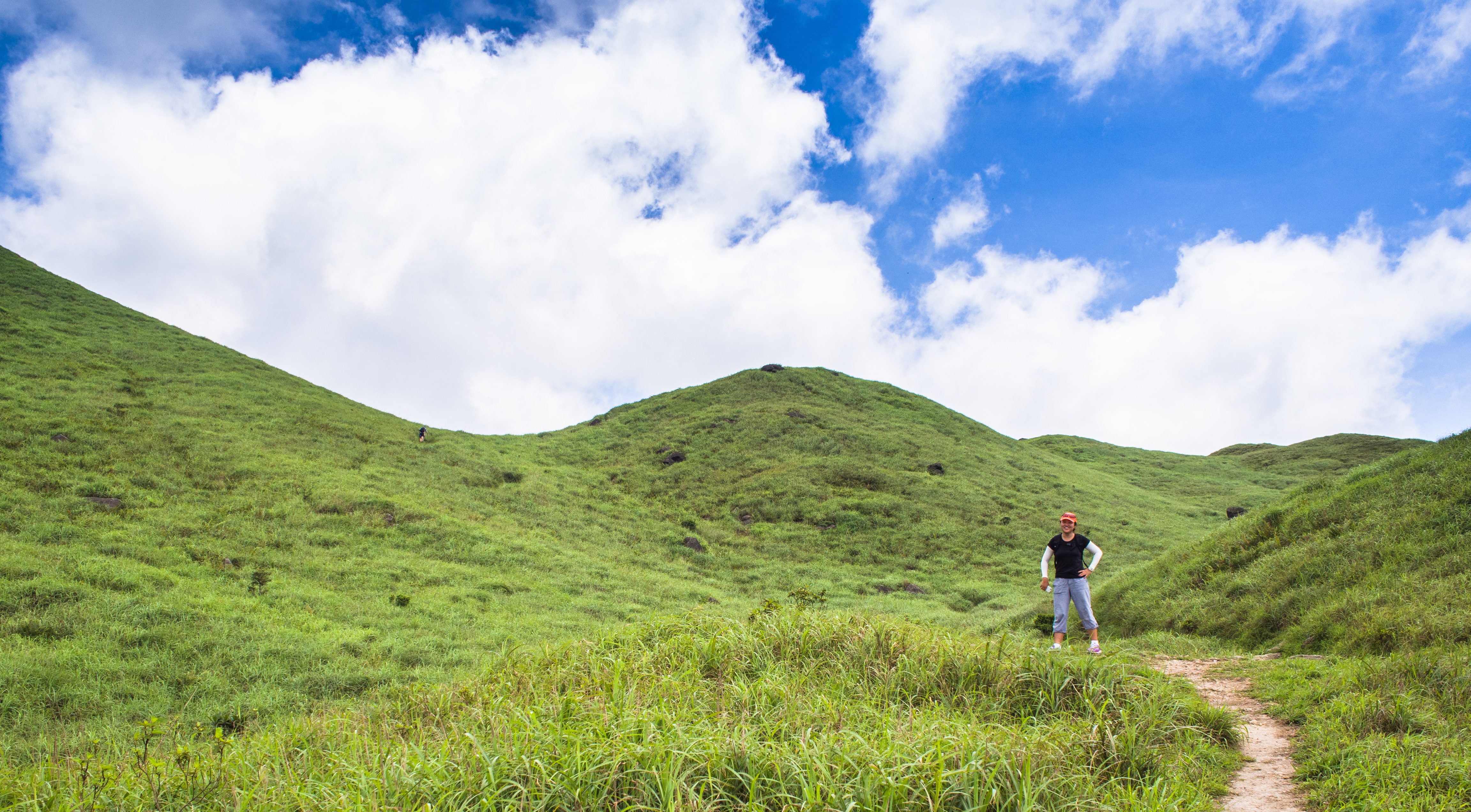 green hills, blue sky and white clouds 