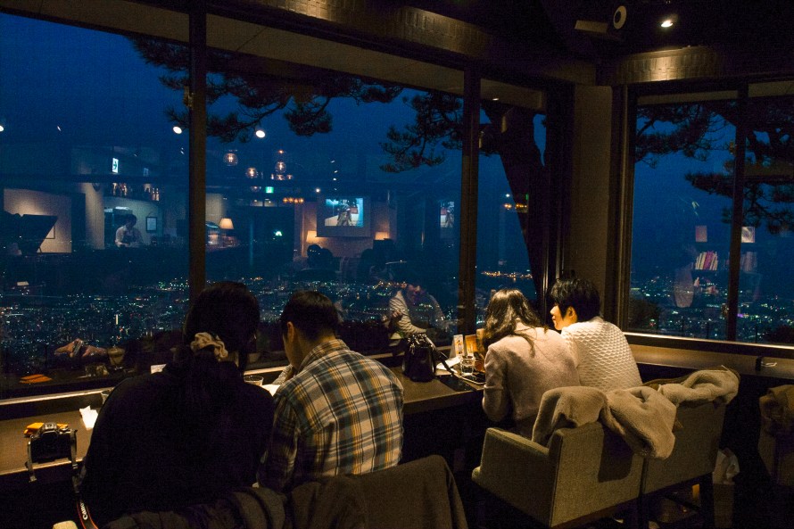 lovebirds hanging out at cafe while admiring scenery